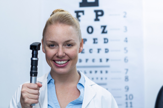 Eyecare professional holding Opthalmascope