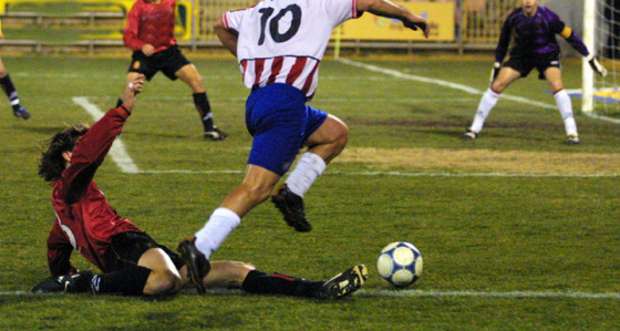 Footballer avoiding a tackle
