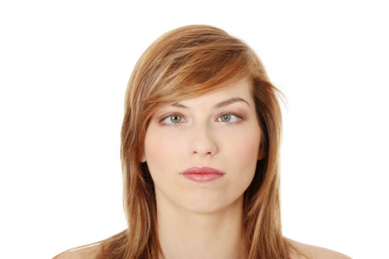 a woman with her eyes squinting